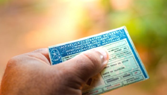 August 28, 2019, Brazil. Man holding document "Carteira Nacional de Habilitação" (CNH). A driver's license attests to a citizen's ability to drive land motor vehicles.