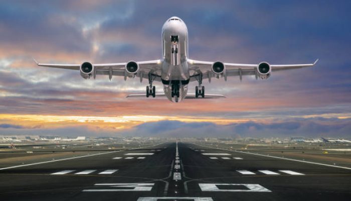 Airplane taking off from the airport, front view.